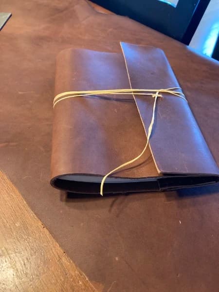 Handmade leather journal tied with linen cord